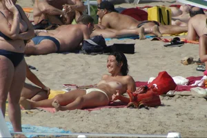 Girls on a nude beach in Sitges, Spain
