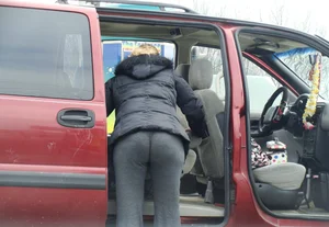 Girls cleaning their cars in jeans and pants