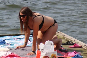 Thick babe with big boobs in a black bikini
