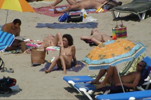 Girls on a nude beach in Sitges, Spain