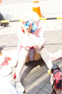 Skinny Cosplayer Girl in Knee Socks Sitting on the Ground Photo