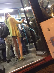 Hot Blonde with Long Skinny Legs Behind the Closing Doors of the Tram
