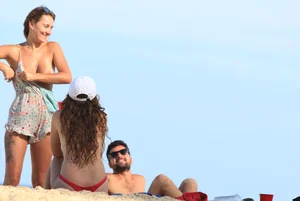 Sexy girls topless on a nude beach showing their nice tits
