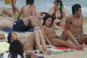 Topless girls on a beach in Barcelona