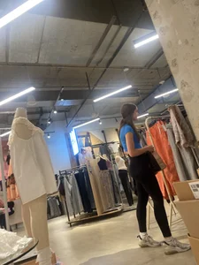 Tall Brunette Fills Out Her Leggings While Shopping