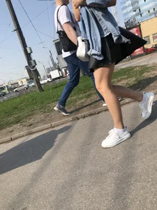 Awesome Candid Girl in a Leather Skirt And Sneakers Walking Down a Street, Then Flashing Her White Panties on the Stairs Creepshots Gallery