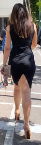 Brunette looking sexy in tight black dress with vpl