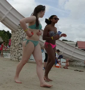Sexy black girl in bikini and short shorts with a cute friend with braces