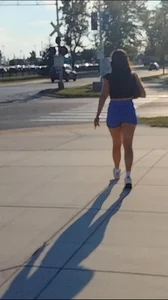Sexy Candid Girl in a Top And Blue Shorts Walking Down the Street Creepshots Gallery