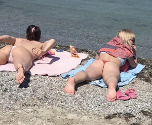 Large collection of hot beach girls lying on the beach and bending over