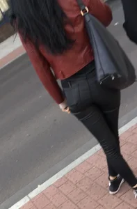 Chav brunette with a nice ass and vpl in tight black leather pants
