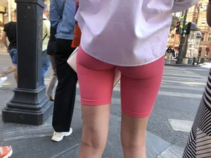 Awesome booty in spandex shorts, candid girl on a sidewalk