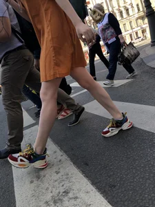 Cute Teen Girl in a Dress With Slim Legs Standing in the Subway Train, Then Crossing the Street Photo Gallery