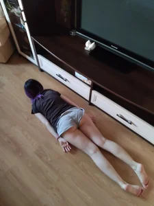 Girl Planking on the Floor in Mini Shorts