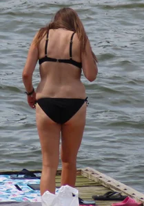 Thick babe with big boobs in a black bikini