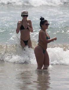 Thick and skinny friends on the beach in thongs