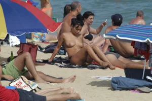 Topless girls on a beach in Barcelona