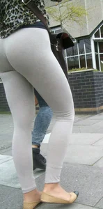 Brunette lady with a nice ass in light grey leggings walking