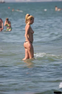 A bunch of sexy beach voyeur babes in bikinis, thongs and topless
