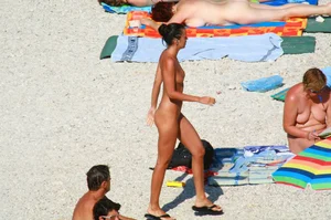 Ula FKK Sexy brunette on a nude beach topless, bottomless and with blue thong