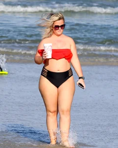 Thick BBW blonde lady in a bikini at the beach