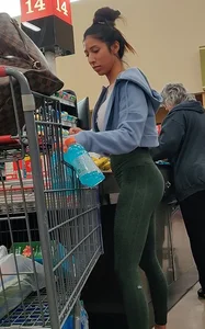 Insanely hot brunette shopping in tight green leggings
