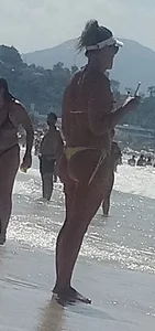 Big booty white chick in a yellow thong at the beach