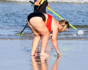 Thick BBW blonde lady in a bikini at the beach