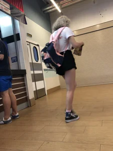 Teen with Fit Muscular Legs in Shorts Food Court Candid