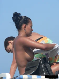 Hot ass topless beach girl with great tits lets her little brother oil up her ass in thong bikini