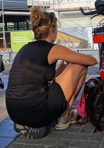 Pretty blonde with a good rack kneels on the platform and spreads her legs for you!