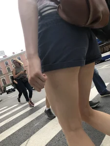 Young Girl in Shorts And Sandals Crossing the Street Gallery
