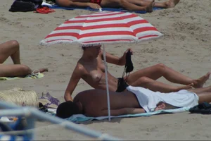 Girls on a nude beach in Sitges, Spain