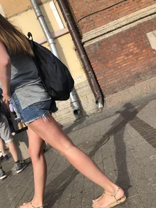 Girl in Denim Mini Shorts and Sandals With Sexy Legs And Feet Street and Subway Photos