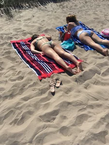 Two Hot Candid Girls in Swimsuits Lying on the Beach Creepshot