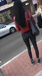 Chav brunette with a nice ass and vpl in tight black leather pants