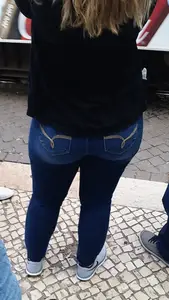 Booty in tight blue jeans gif at the bus stop