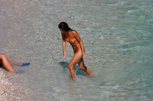Ula FKK Sexy brunette on a nude beach topless, bottomless and with blue thong