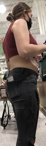 Latina in Maroon crop top and tight black jeans