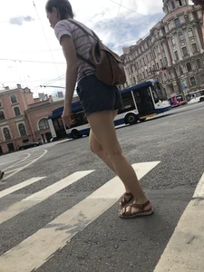 Young Girl in Shorts And Sandals Crossing the Street Gallery