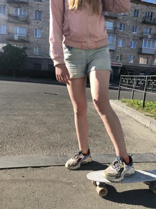 Girl in Denim Shorts on Skateboard Street Candid Photos