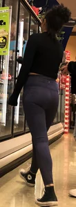 Girl with glasses shopping in leggings showing her VPL
