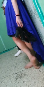 Girl in a Blue Dress and Pantyhose Feet Closeup