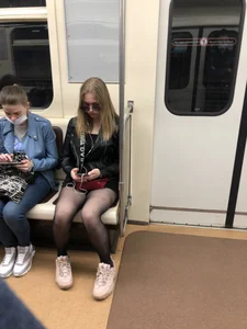 Candid Girl in Sunglasses And Black Pantyhose With Hot Thin Legs Sitting in a Subway Train Creepshots