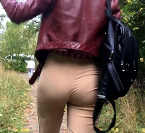 Girl with Hot Ass in Tight Beige Pants Going Down the Countryside Road Closeup Creepshots