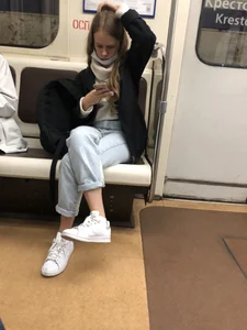 Cute and grumpy looking candid girl wearing jeans in subway creepshots