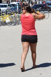 Thick girl in pink top and black shorts with vpl