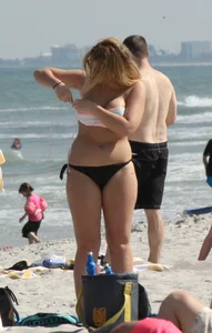 Big boobed thick blonde on the beach in a bikini