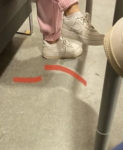 Skinny Ass in Loose Pink Pants And Feet in Sneakers - Girl Lying on the Couch With Her Legs Up