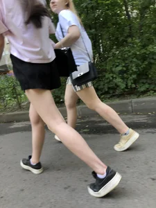 Couple of candid teens walking down the street